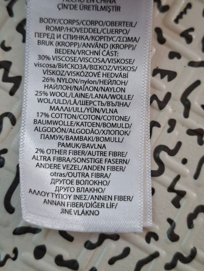 Pull torsadé blanc écru pailleté Polo Ralph Lauren - bébé 2 ans - seconde main -30% Viscose - 26% nylon - 25% laine - 17 % coton - 2% autre fibre 